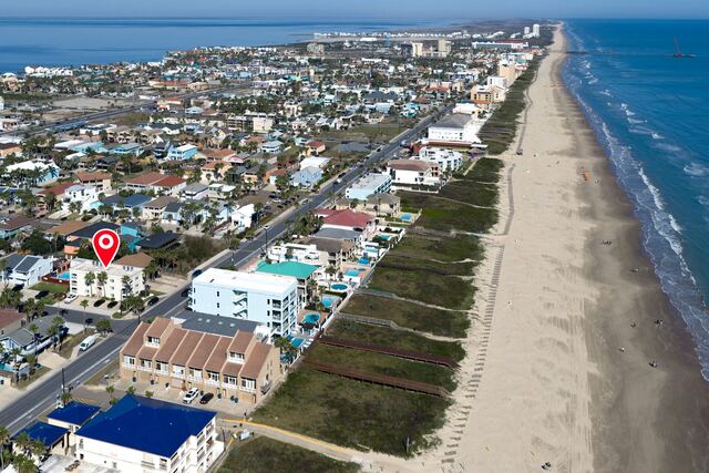 Outdoor poolside seating at Athena Ares Seaside Estate, South Padre Island