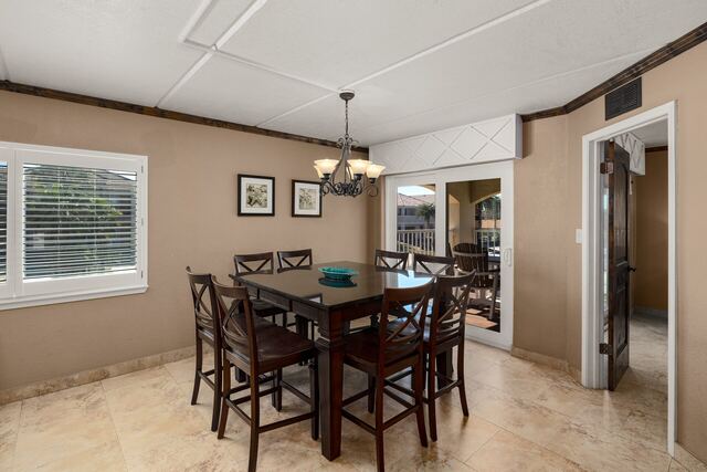 Pool deck loungers and umbrella at Athena Ares Seaside Estate, South Padre Island