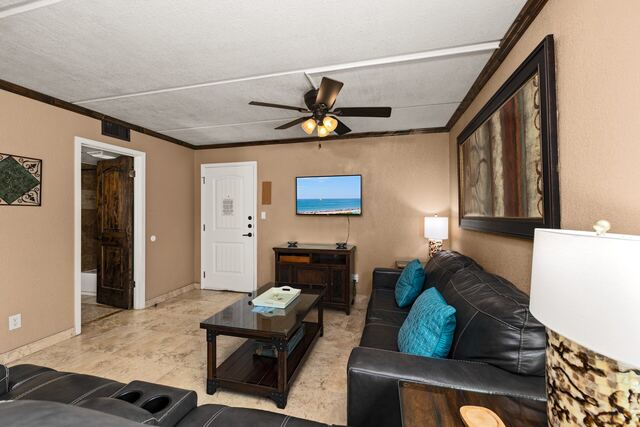 Pool deck loungers and umbrella at Athena Ares Seaside Estate, South Padre Island
