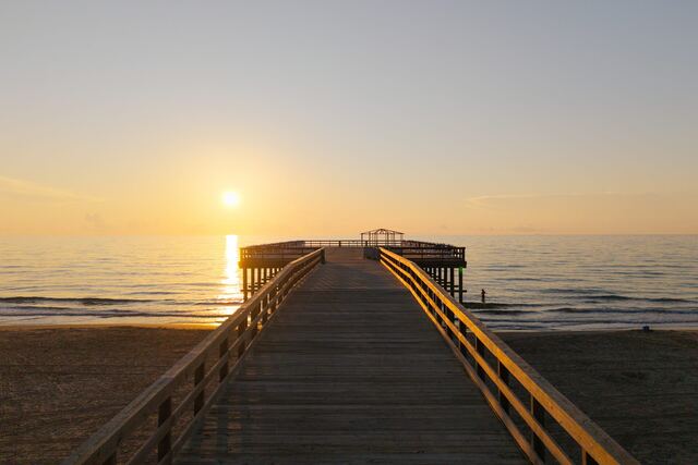 Heated pool and hot tub deck at Athena Ares Seaside Estate, South Padre Island