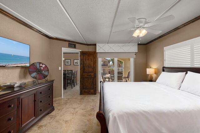 Pool deck loungers and umbrella at Athena Ares Seaside Estate, South Padre Island